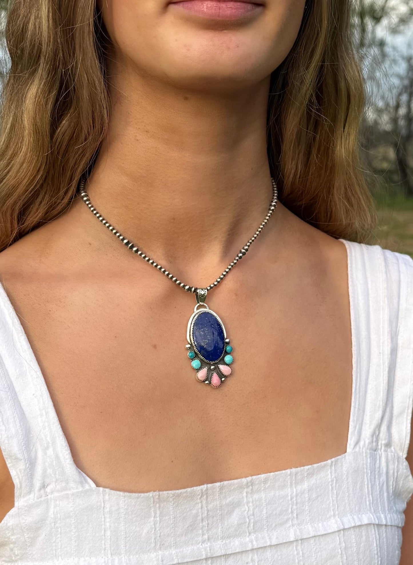 Multi-stone pendant showing size and proportions when worn