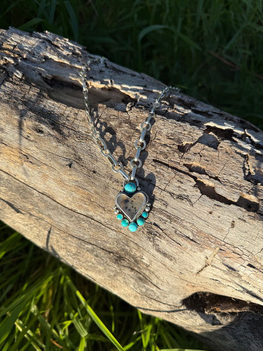 Close-up of Montana agate showing natural patterns with bright blue Kingman turquoise