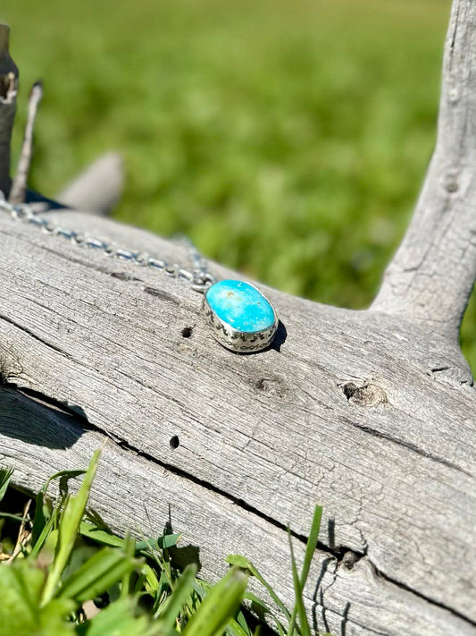 Detailed view of chunky Royston turquoise beads and sterling silver components, artisan western necklace