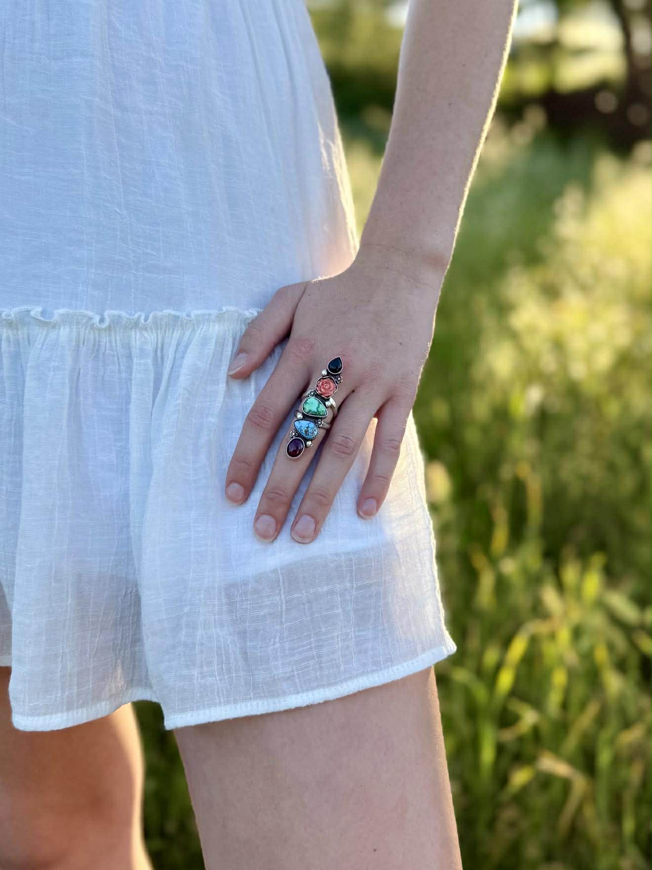 Multi-stone crawler ring worn on finger, bold boho western statement jewel