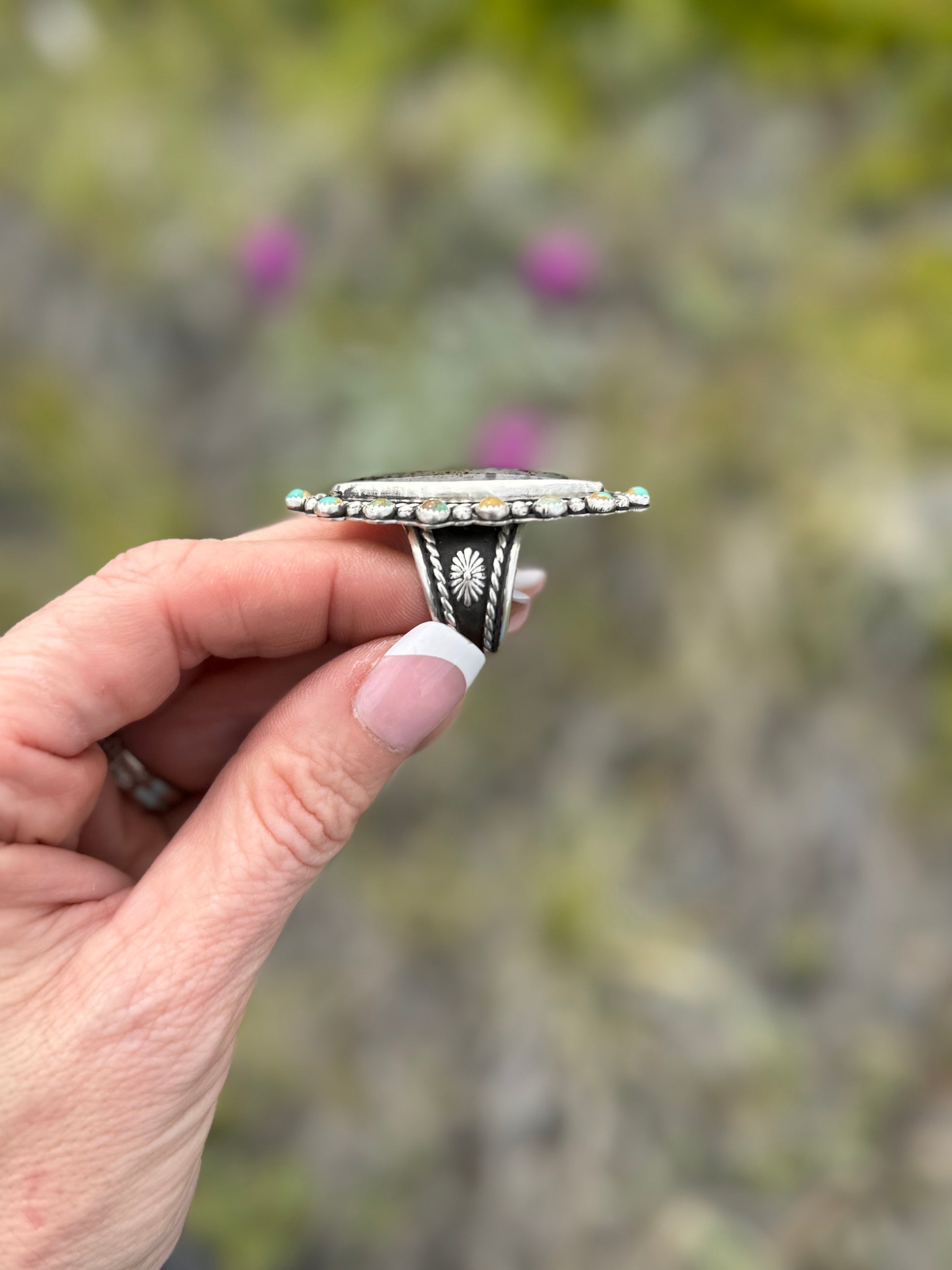 Side view of handmade Montana Agate and Kingman Turquoise statement ring with sterling silver concho band
