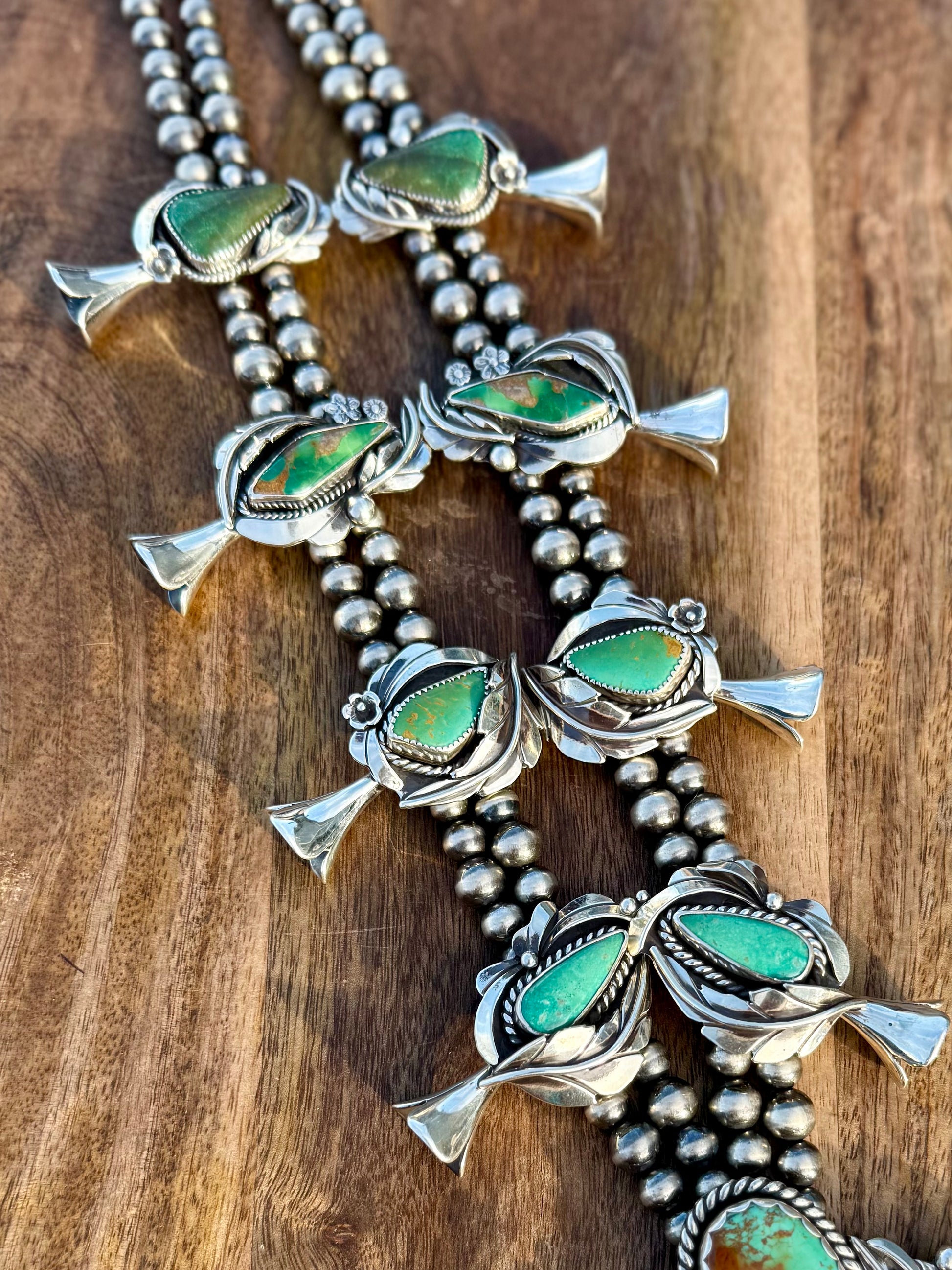Close-up of Royston turquoise stones showing natural ombre color variation and matrix of the blossoms