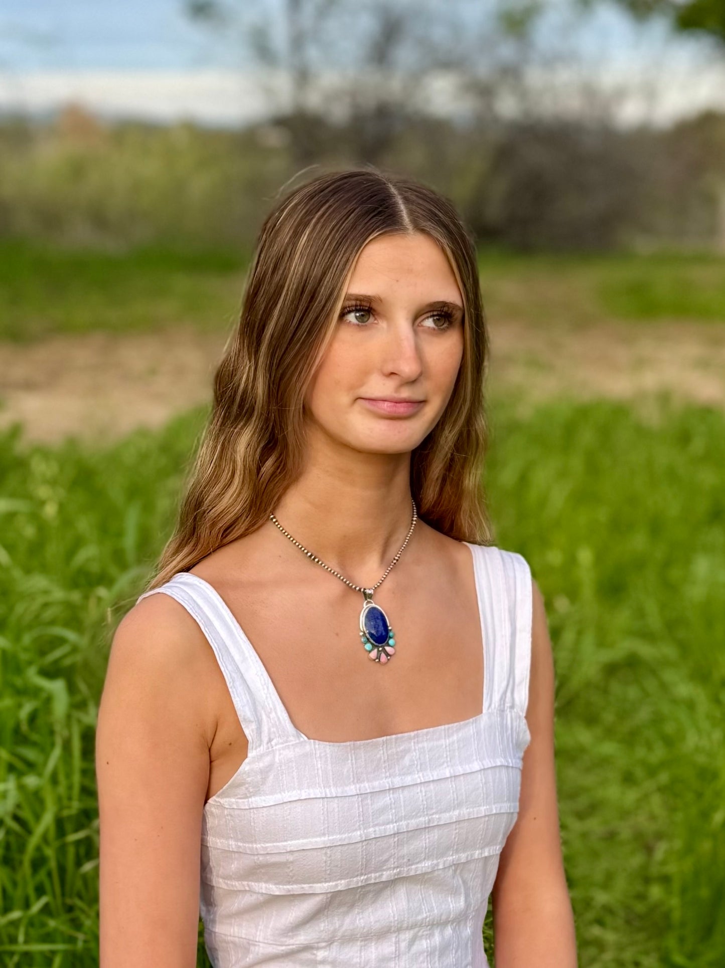 Multi-stone pendant worn with lapis, turquoise, and conch, boho western statement jewelry