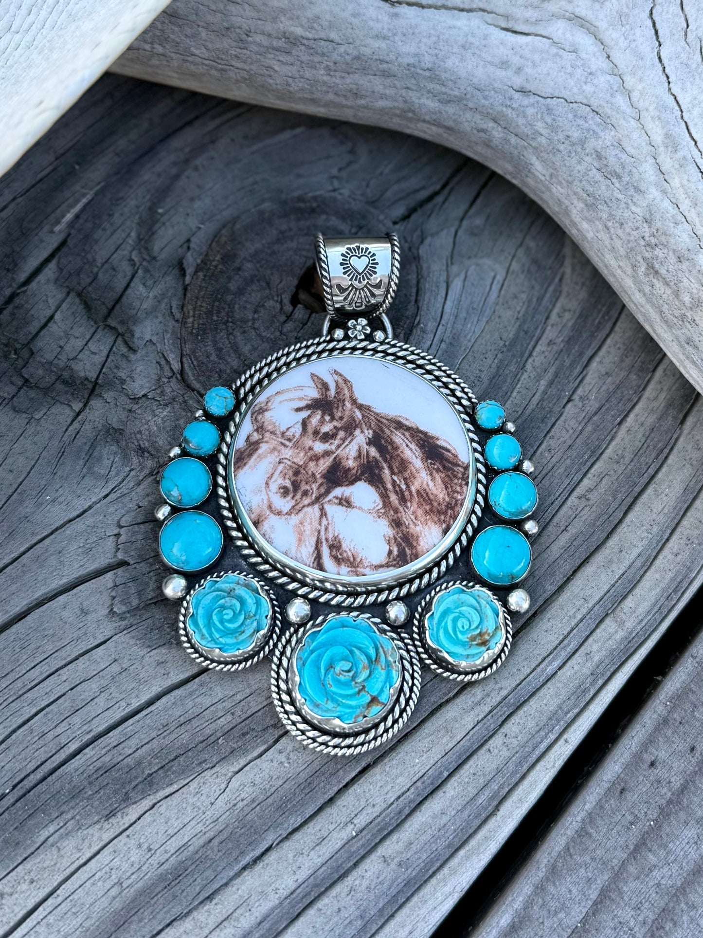 Pendant with porcelain horse design and turquoise hand carved roses showing sterling silver detail