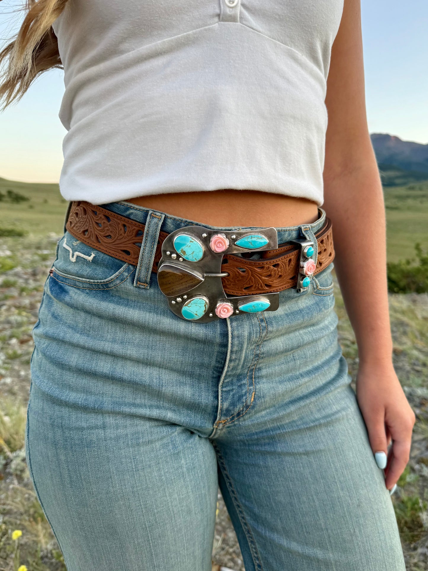 Handmade steel western belt buckle featuring Montana Agate, Kingman Turquoise, Pink Conch shell roses, handcrafted .999 fine silver bezels, and matching belt keeper.