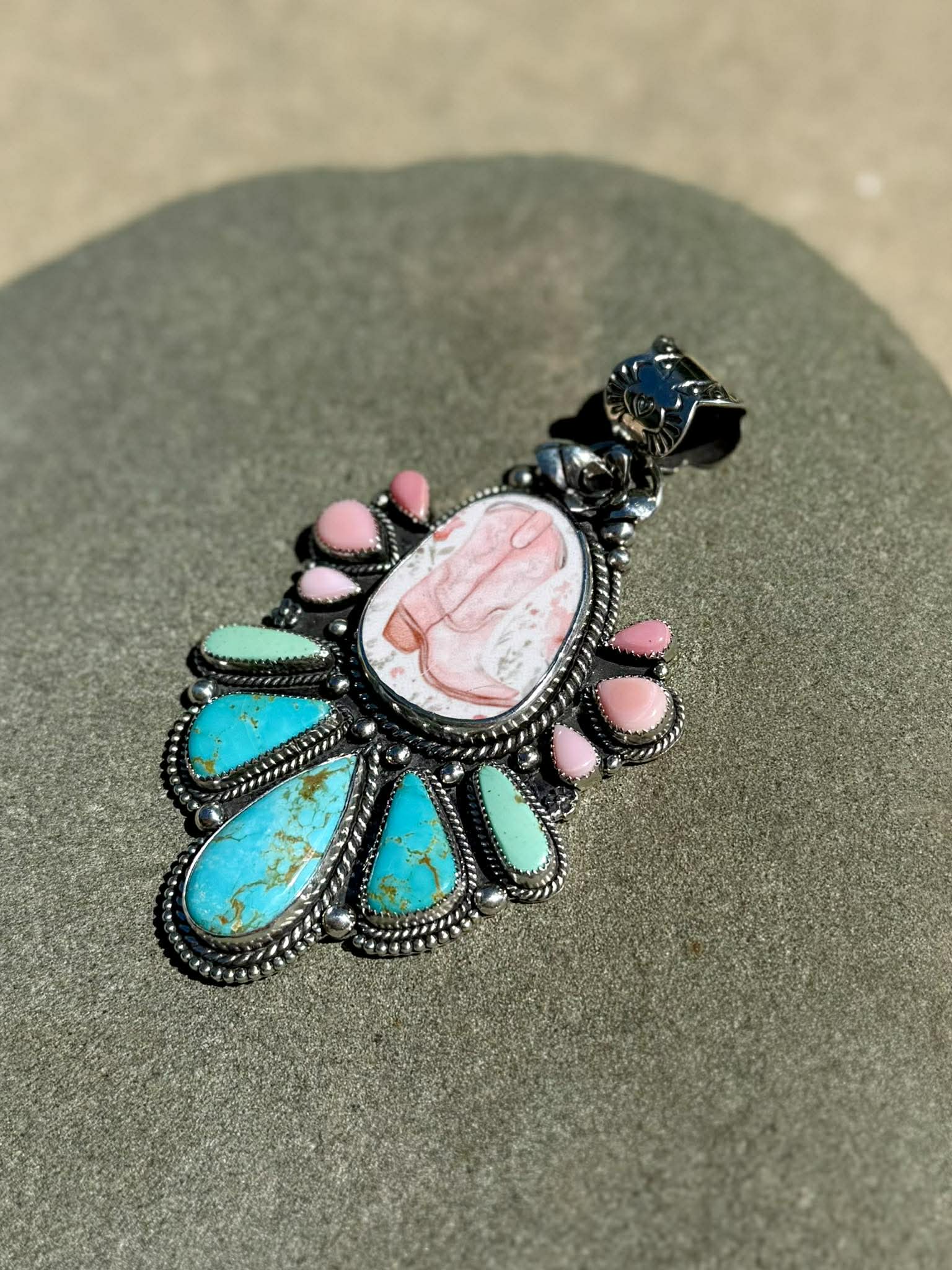Side view of sterling silver boot pendant showing depth and craftsmanship