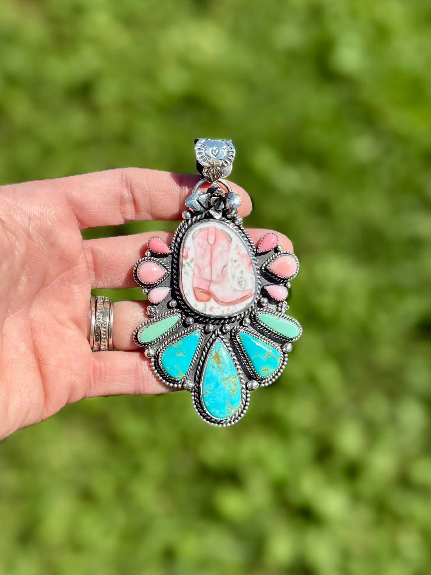 Handmade porcelain cowboy boot pendant with Royston turquoise, pink conch, and sterling silver succulent detail