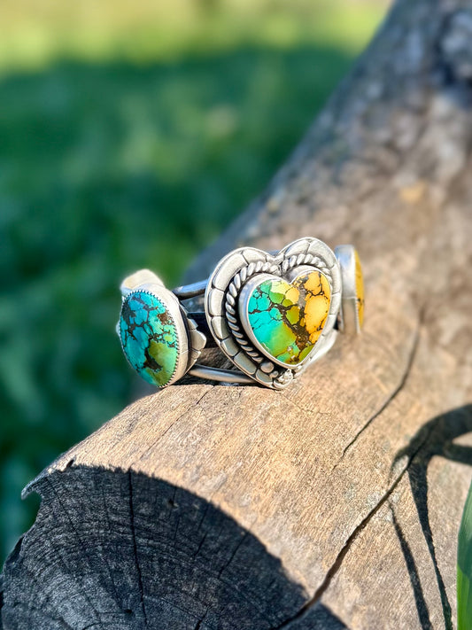 Side view of sterling silver cuff bracelet showing turquoise setting and band