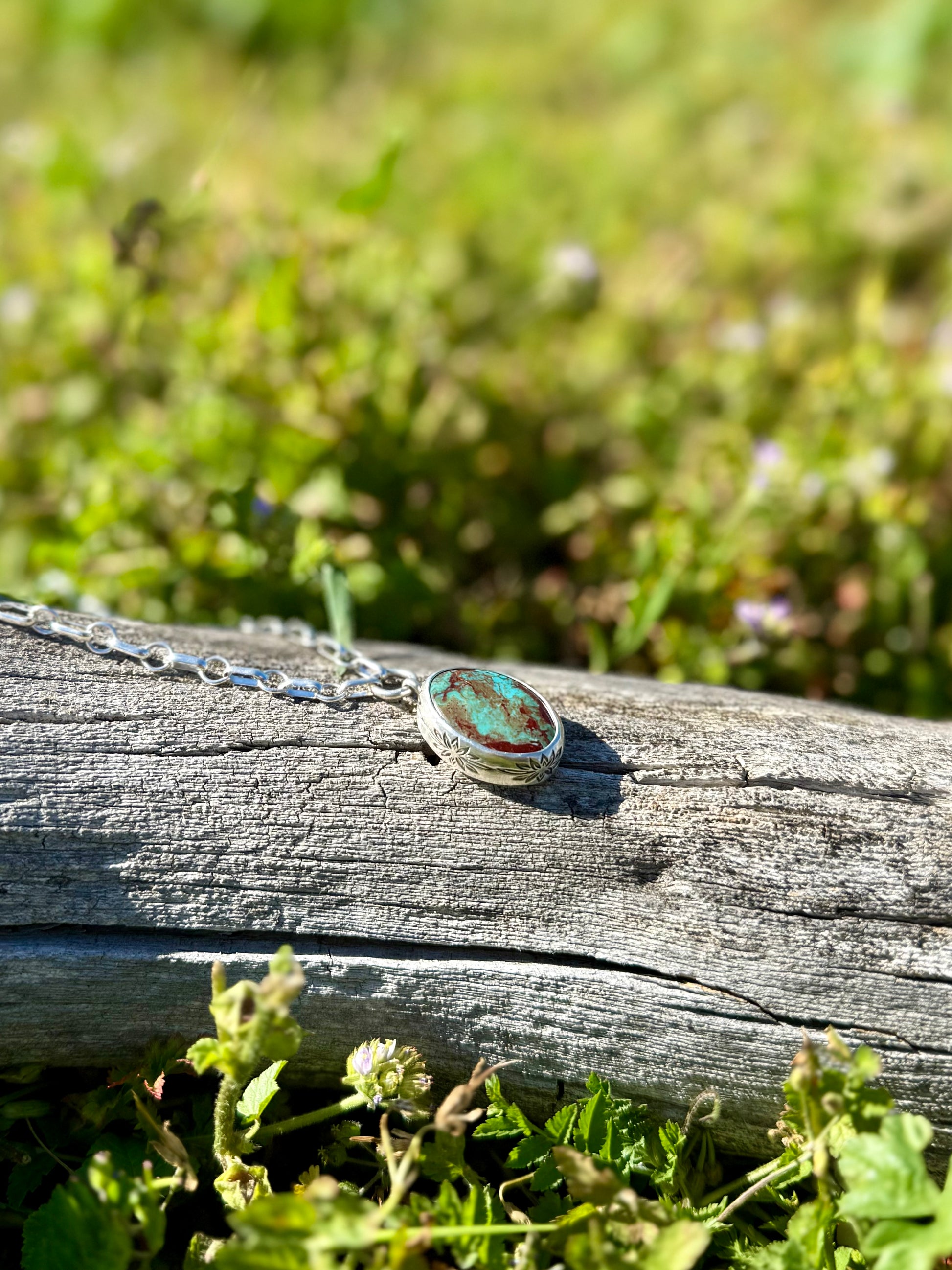 Close-up of natural Royston turquoise beads and sterling silver stamped bezel pendant, handmade artisan necklace