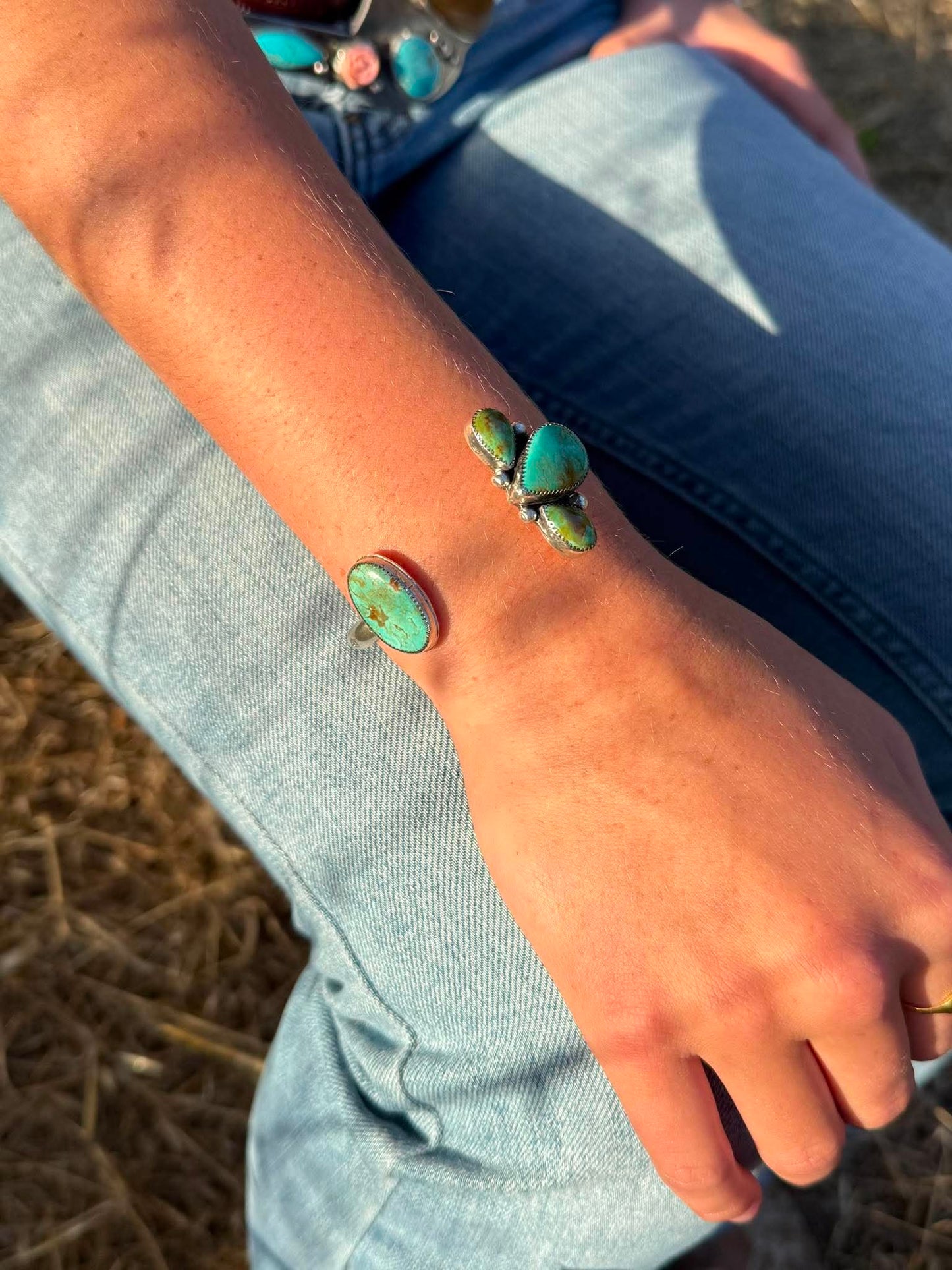 Handmade sterling silver cuff bracelet with Kingman and Chilean turquoise in asymmetrical pinch petal floral design