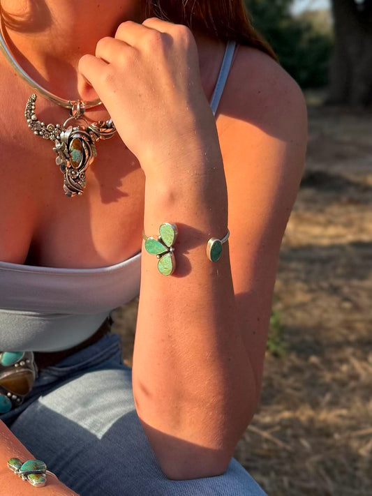 Handmade sterling silver cuff bracelet with Sonoran Gold and Chilean turquoise in asymmetrical floral pinch petal design