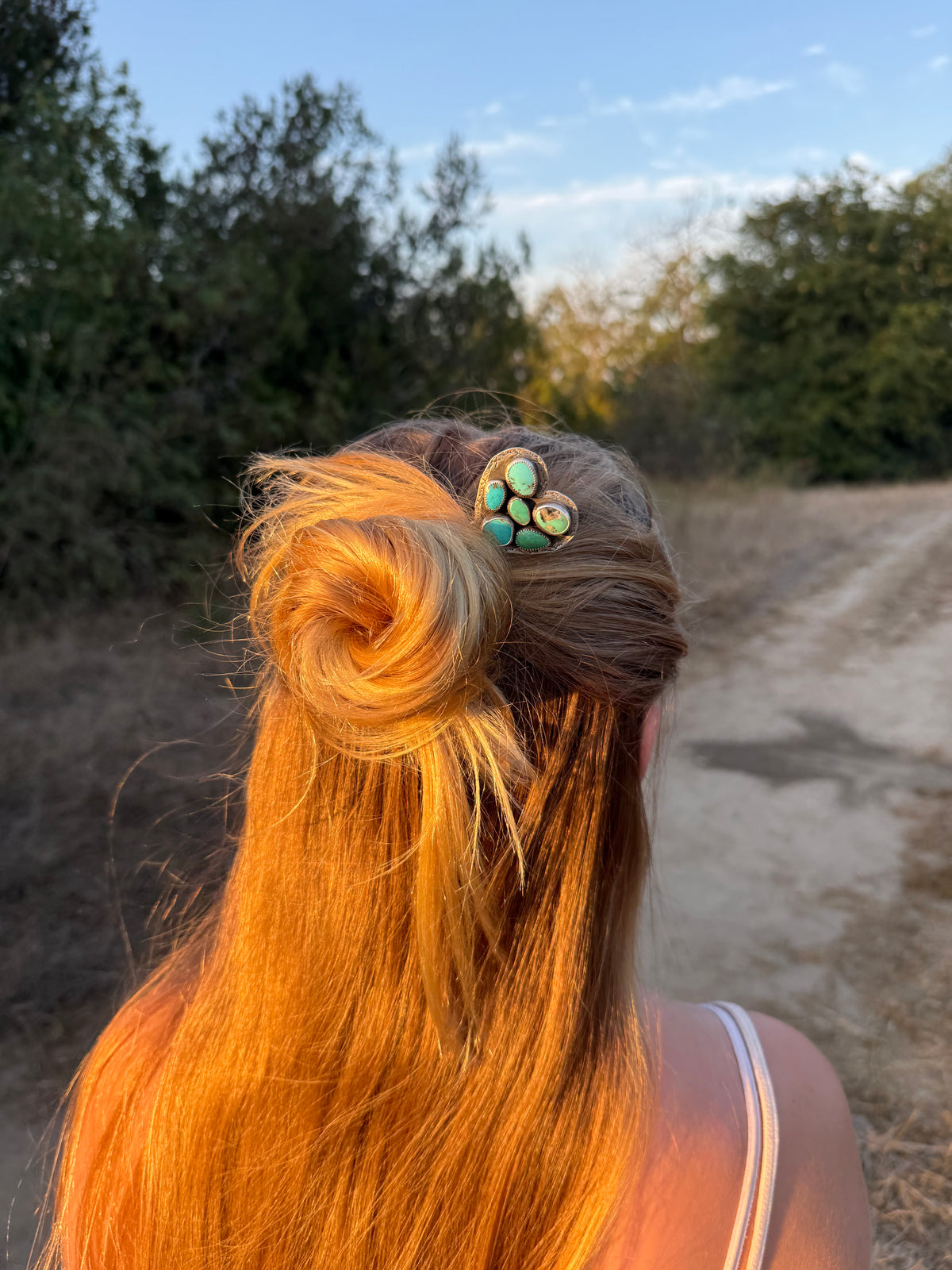 Mixed turquoise heart sterling silver hair pin with Ear Mountain stamped border worn in an updo by Donnalee Silver