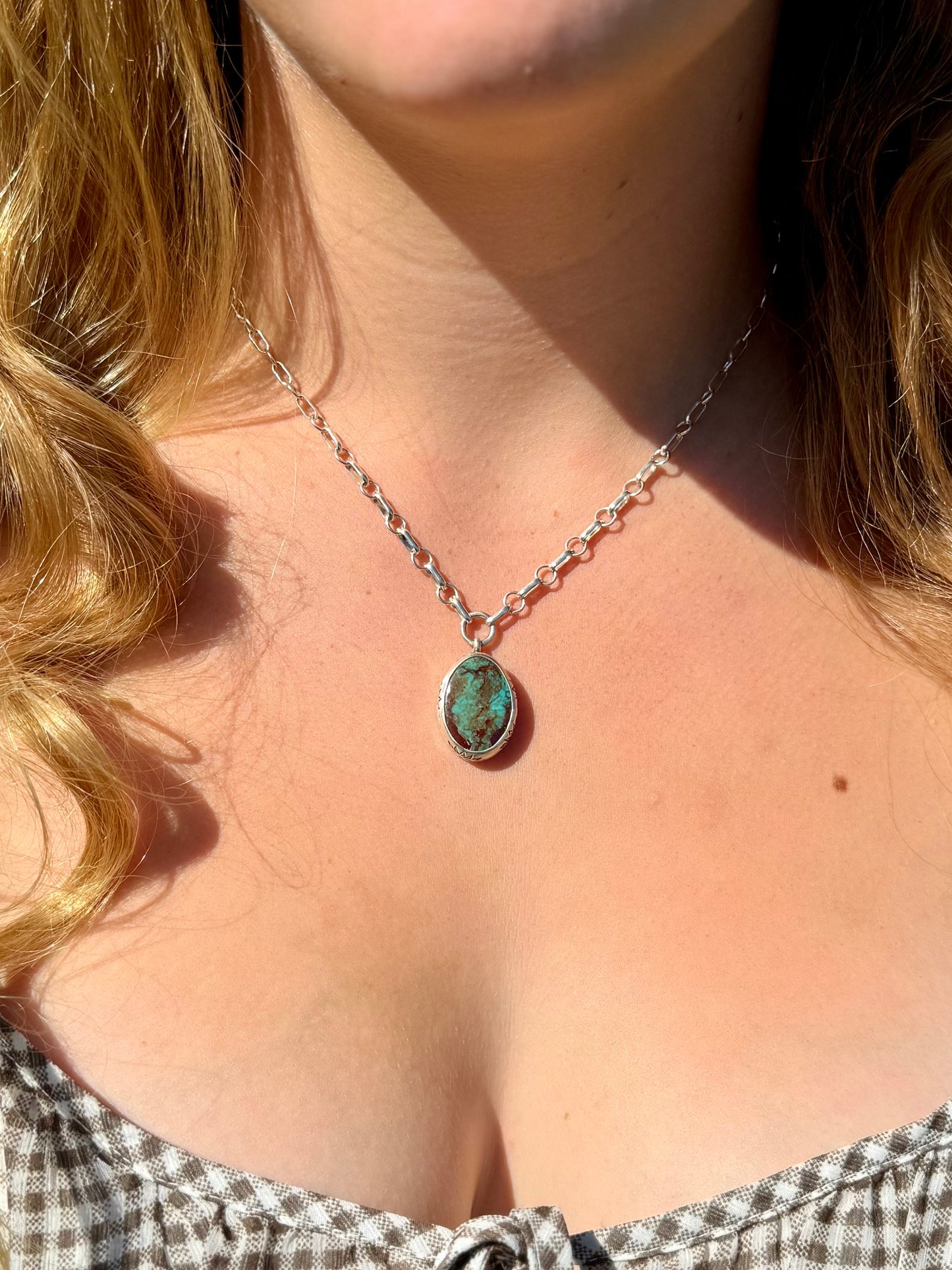 Boho western turquoise necklace with chunky Royston beads and sterling silver pendant styled outdoors in natural light