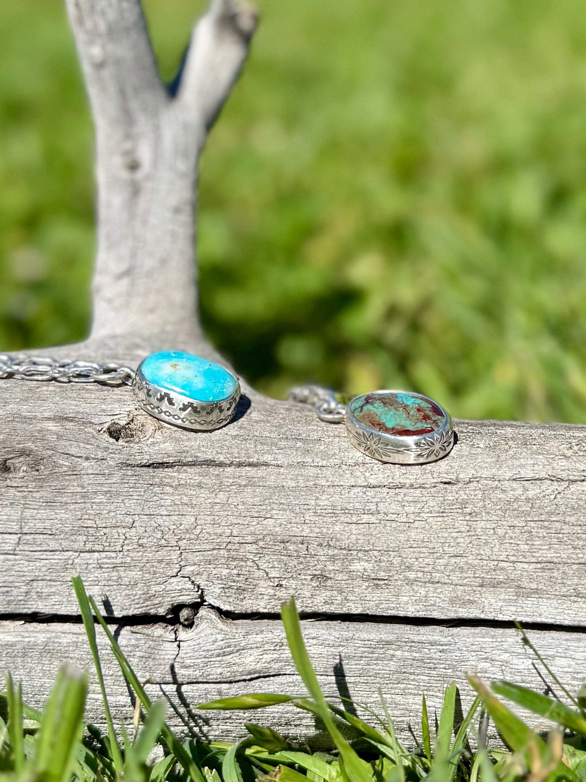 Close-up of natural Royston turquoise beads and sterling silver stamped bezel pendant, handmade artisan necklace shown with other similar necklace