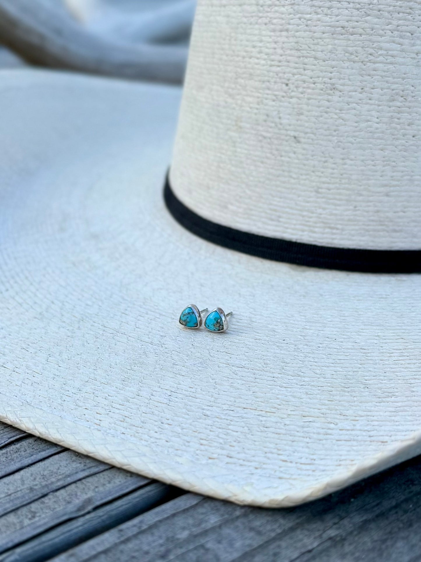 Persian turquoise pyrite stud earrings showing size and proportions on ear