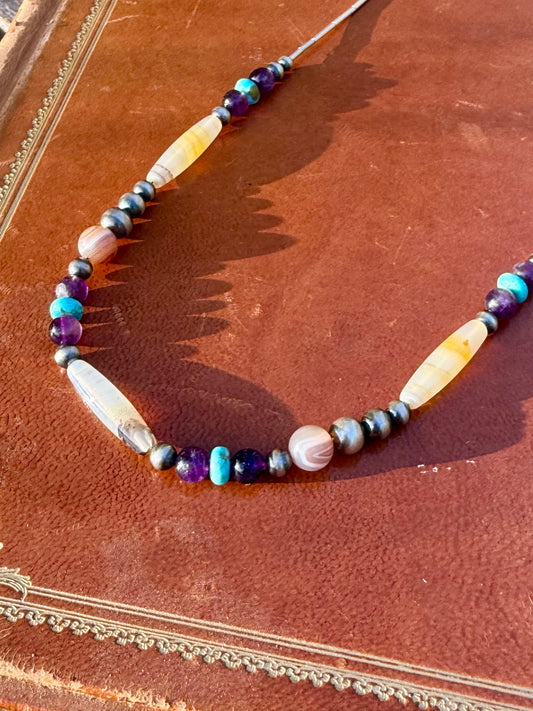 Close up of Montana Agate Amethyst Kingman turquoise sterling silver pearls and liquid silver tube beads