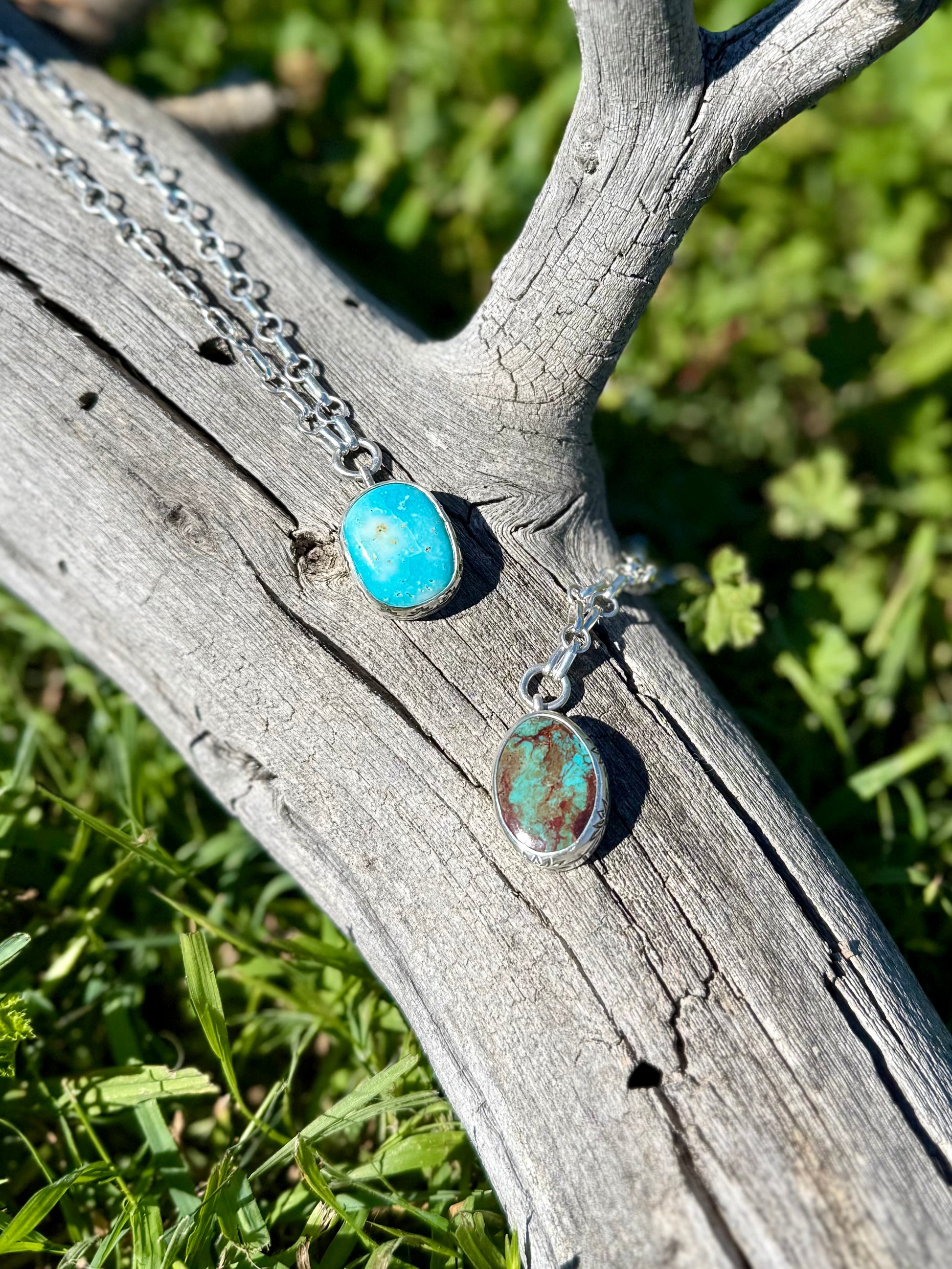 Sterling silver pendant with stamped bezel setting featuring natural Royston turquoise stone, handcrafted boho western jewelry shown with other similar necklace