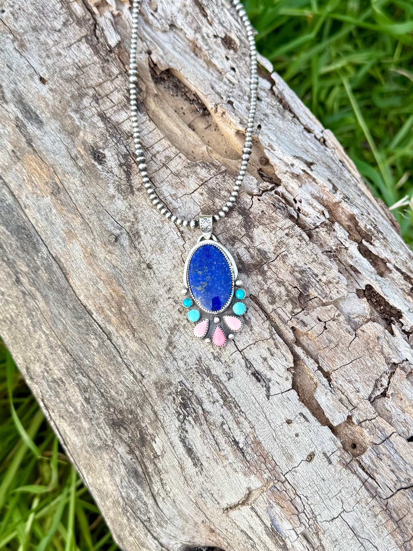 Close-up of lapis lazuli, pink conch, and turquoise showing color contrast and natural detail