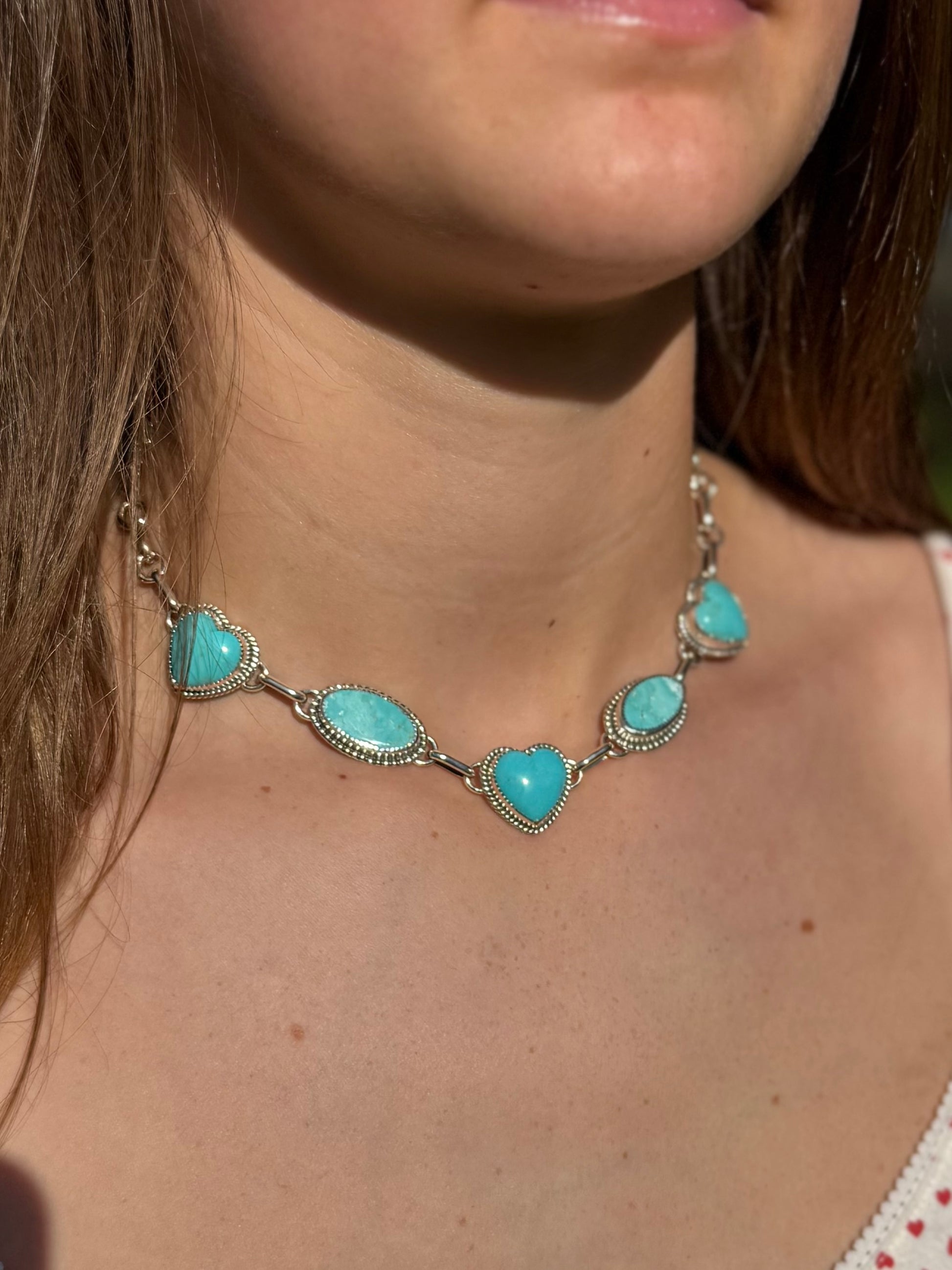 Turquoise heart necklace showing size and proportions when worn