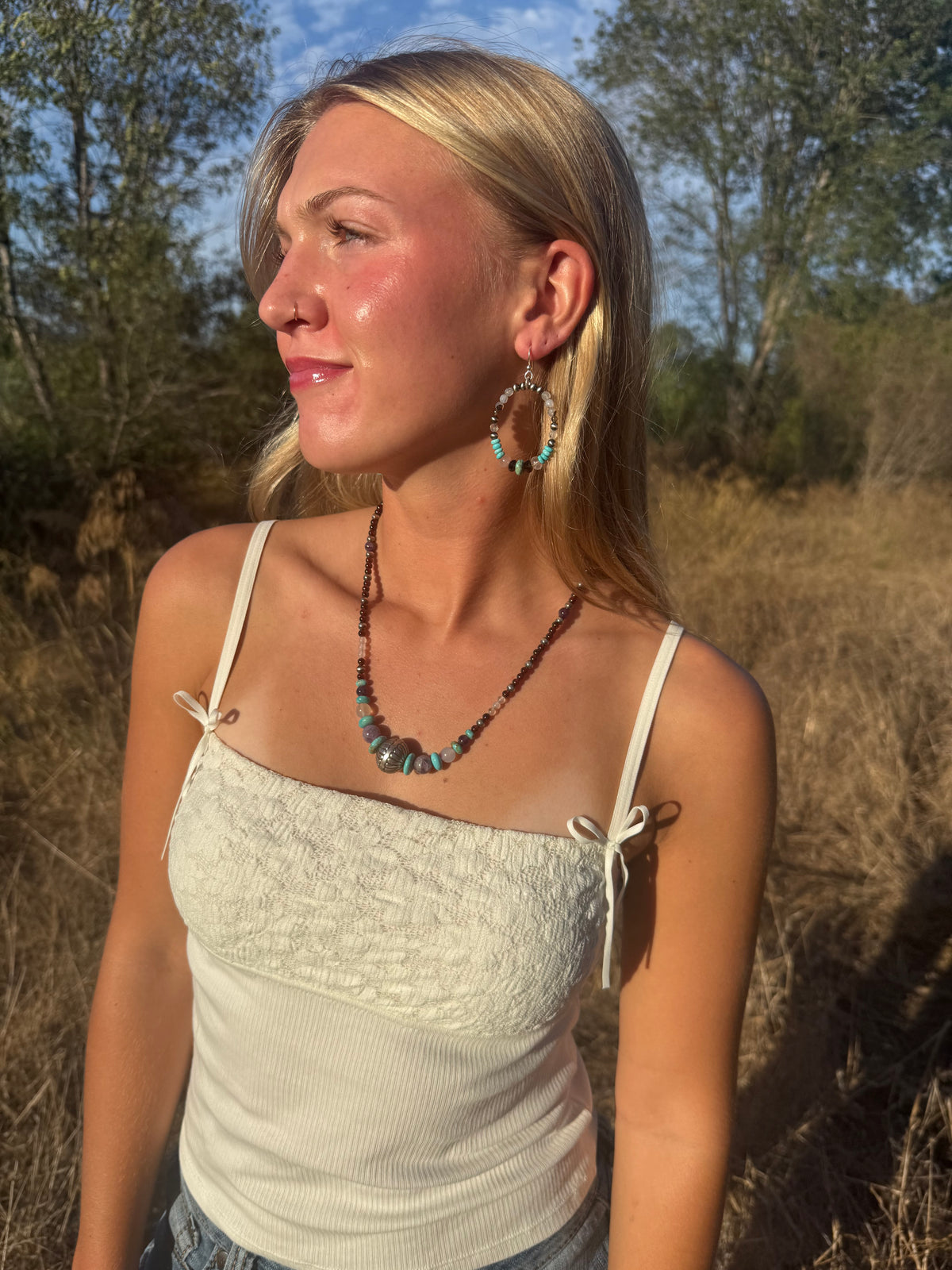 Model wearing Garnet Montana Agate Amethyst and Kingman turquoise beaded necklace by Donnalee Silver