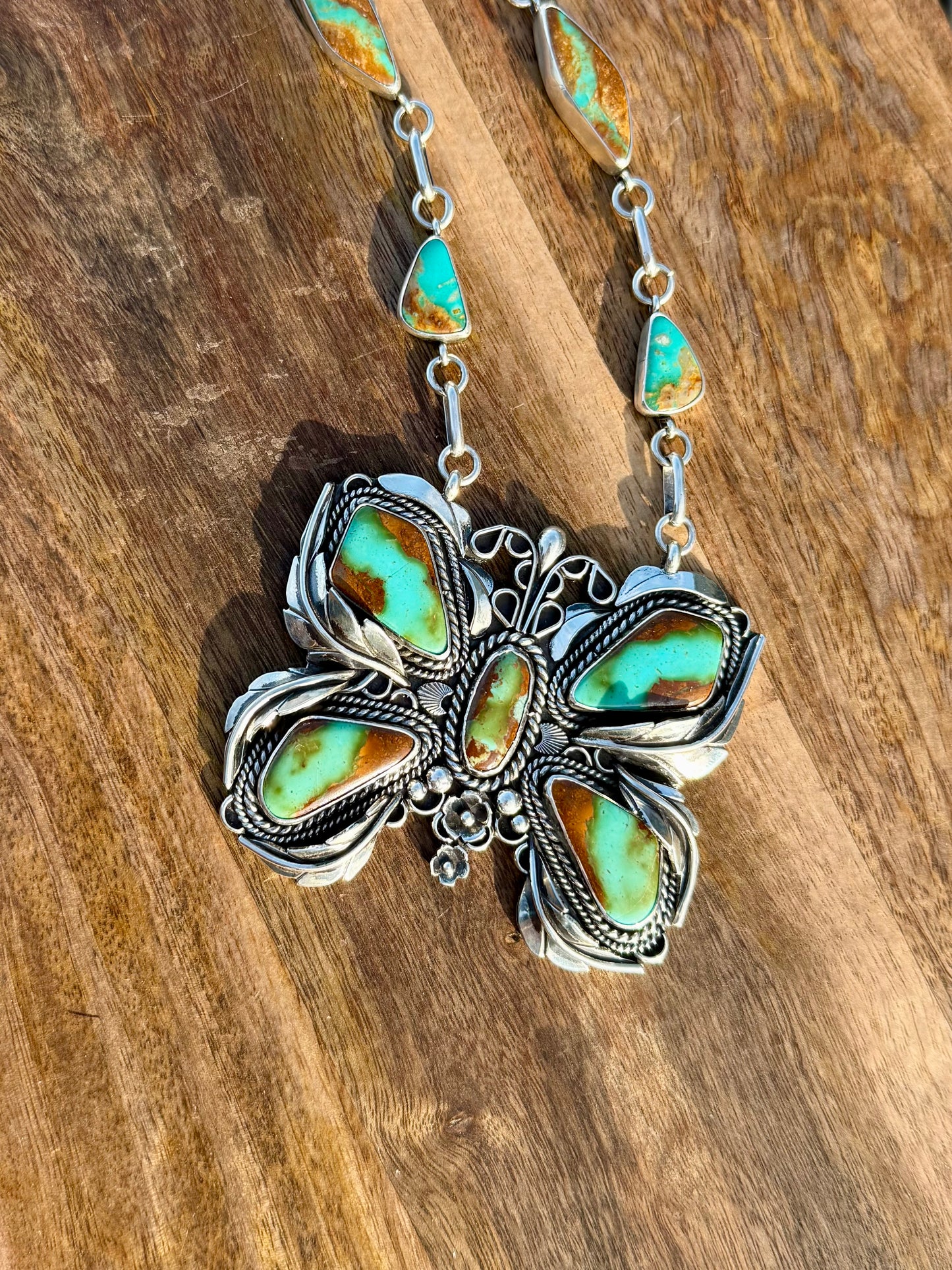 Close-up of Royston ribbon turquoise showing natural veining and butterfly design detail