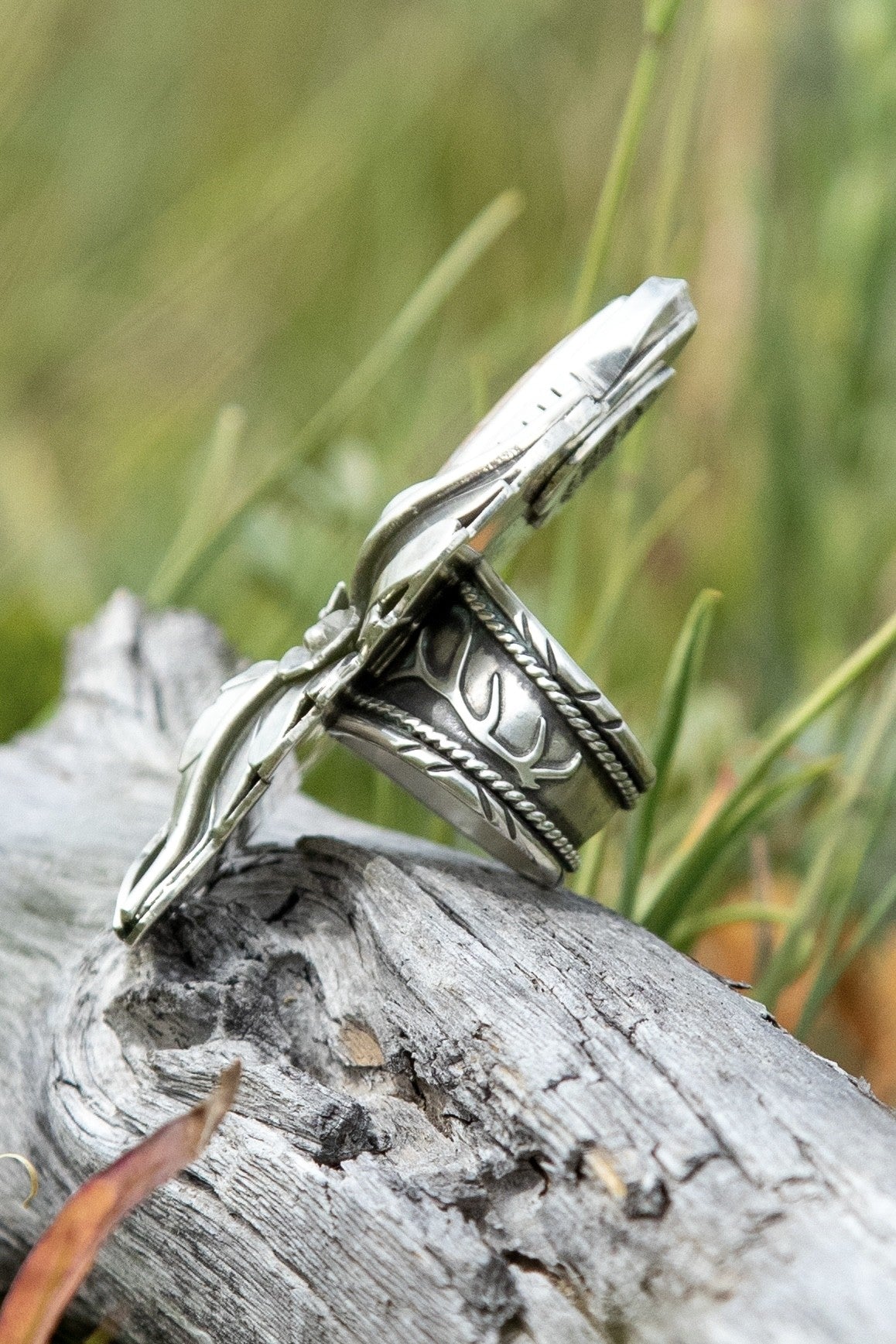Side view of Spotted Fawn Jasper sterling silver ring showing wide hand-decorated antler band by Donnalee Silver