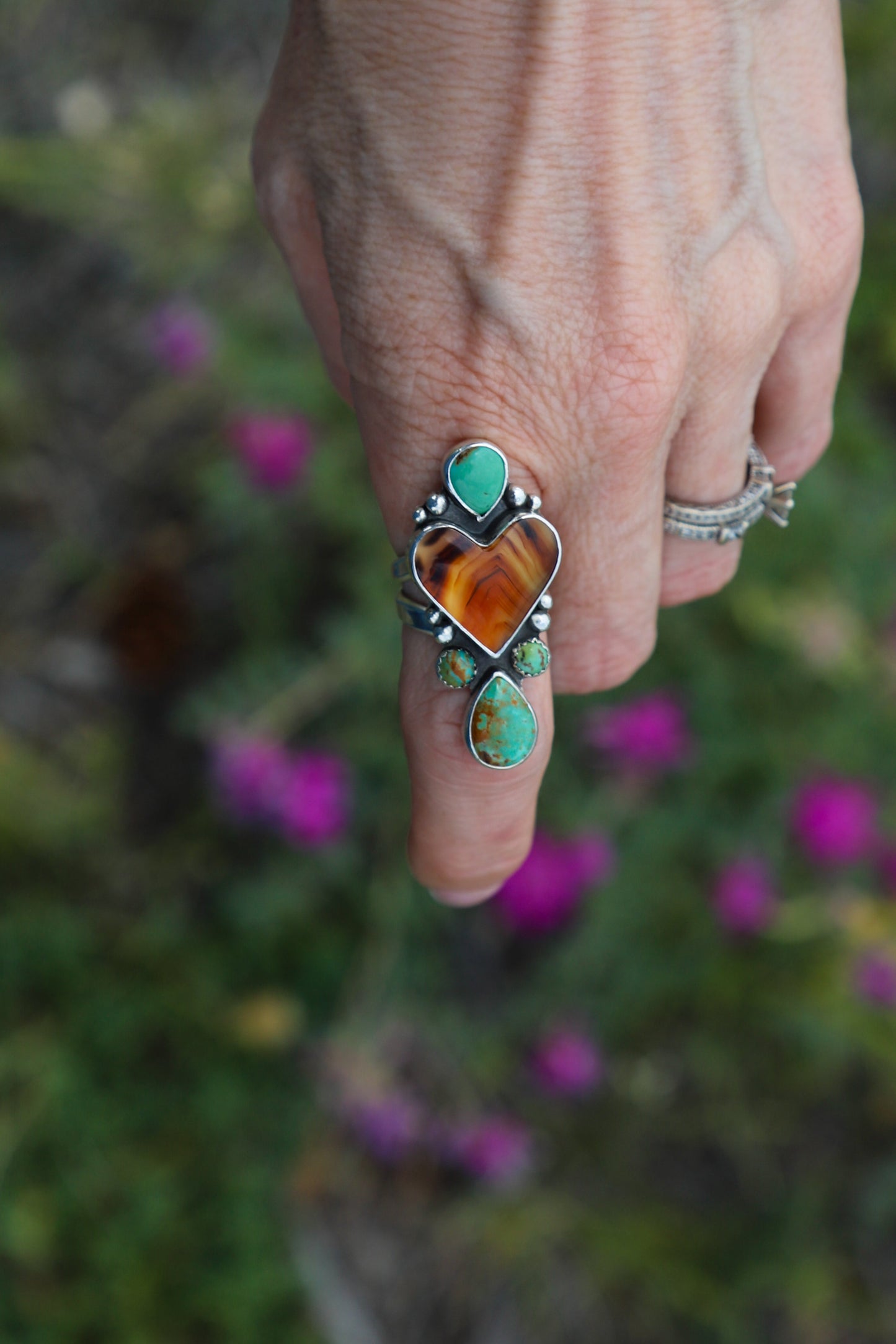 Handmade sterling silver split shank ring featuring genuine Montana Agate accented with Kingman Turquoise statement stones.