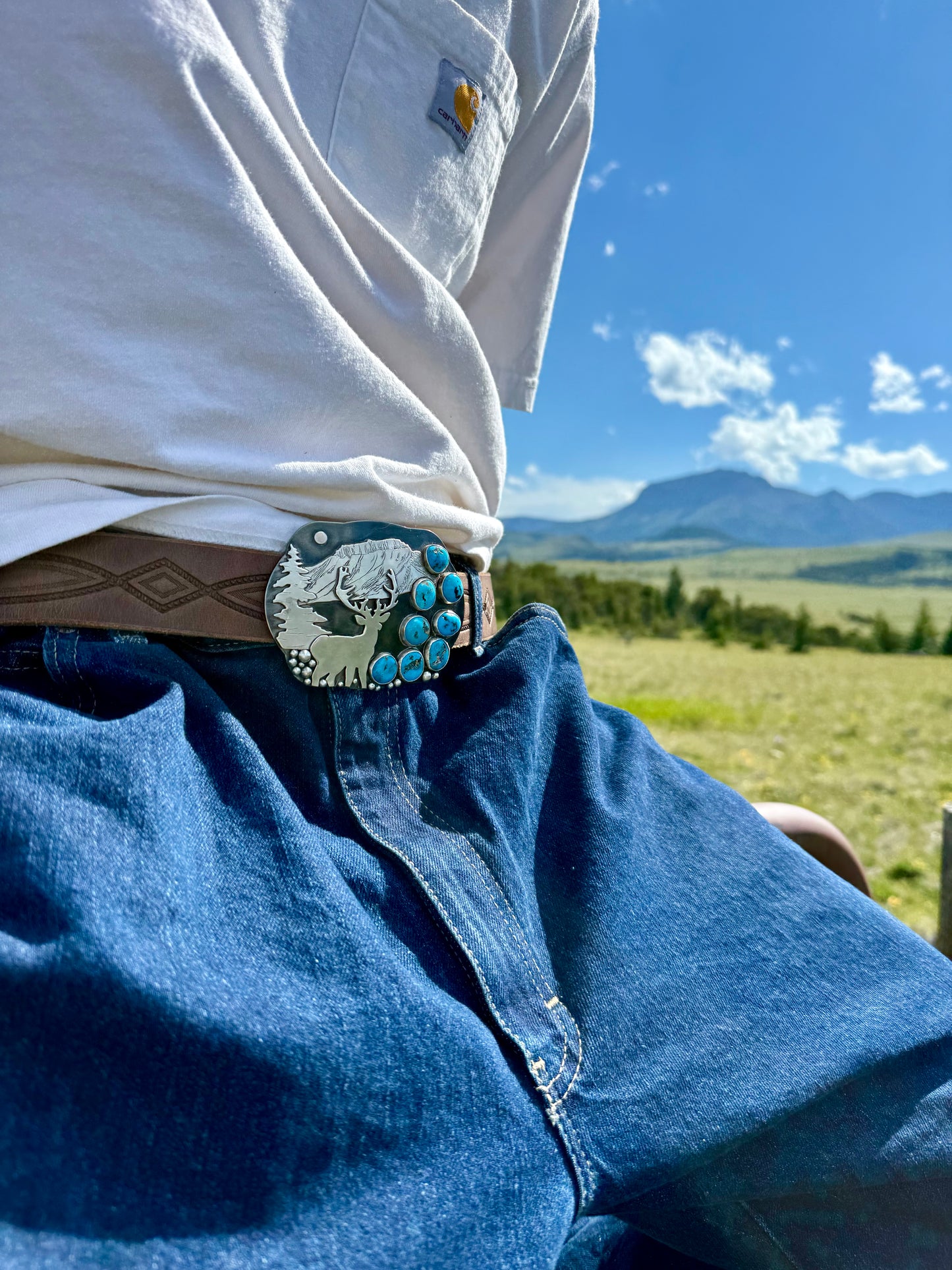 Donnalee Silver Ithaca Peak Turquoise hand engraved elk western belt buckle from the Montana Collection.