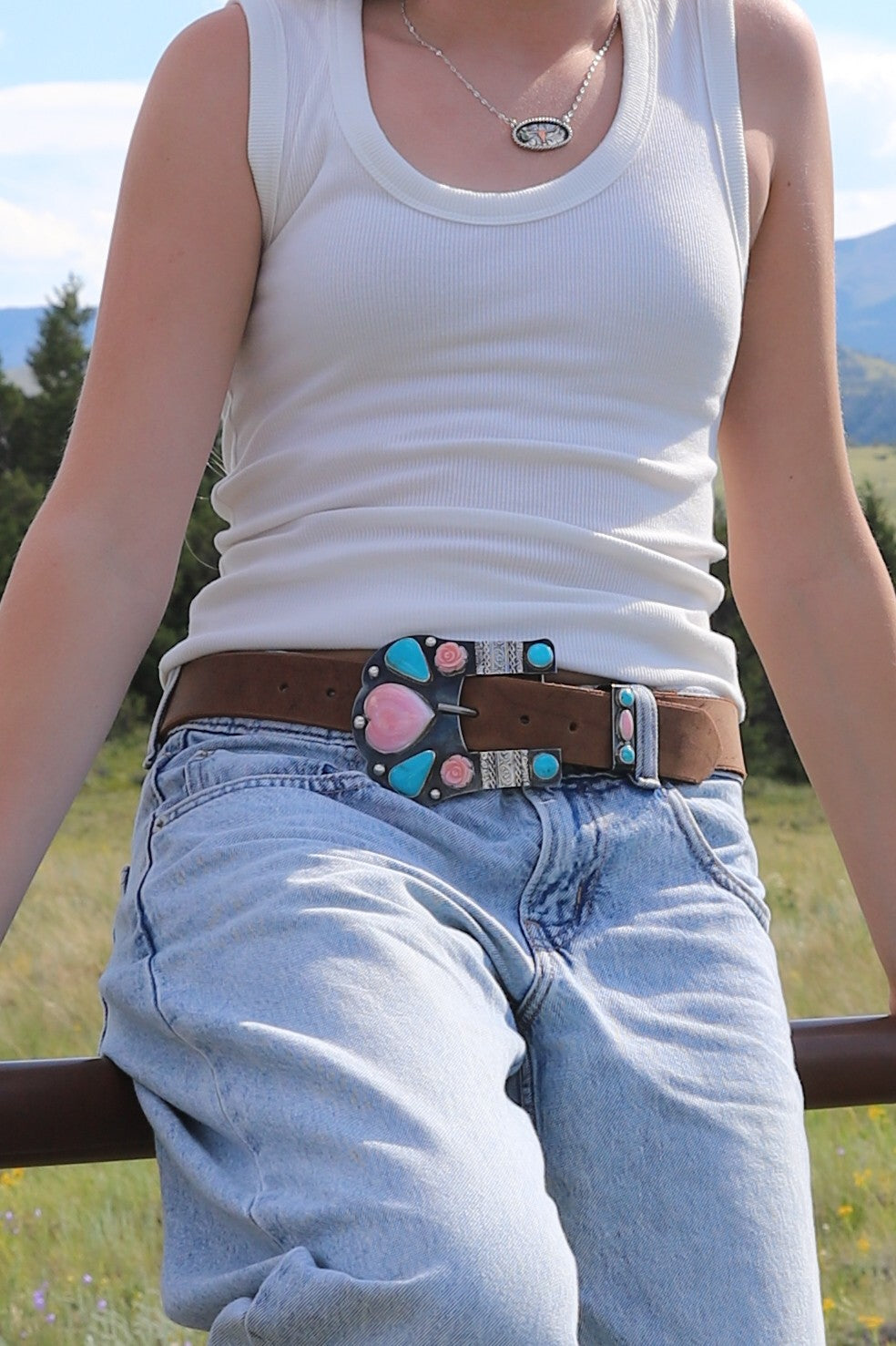 Handmade western belt buckle featuring Kingman turquoise, Royston turquoise and carved Pink Conch set in fine silver bezels