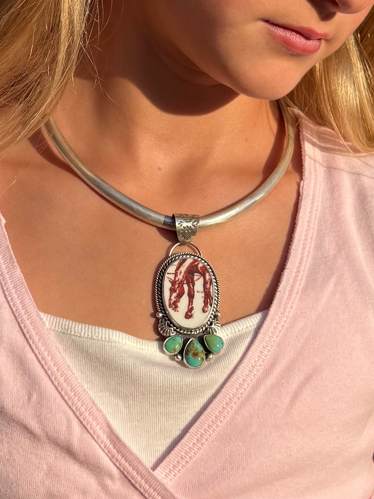 Handmade porcelain horse and Kingman Turquoise sterling silver pendant worn on a silver collar necklace.
