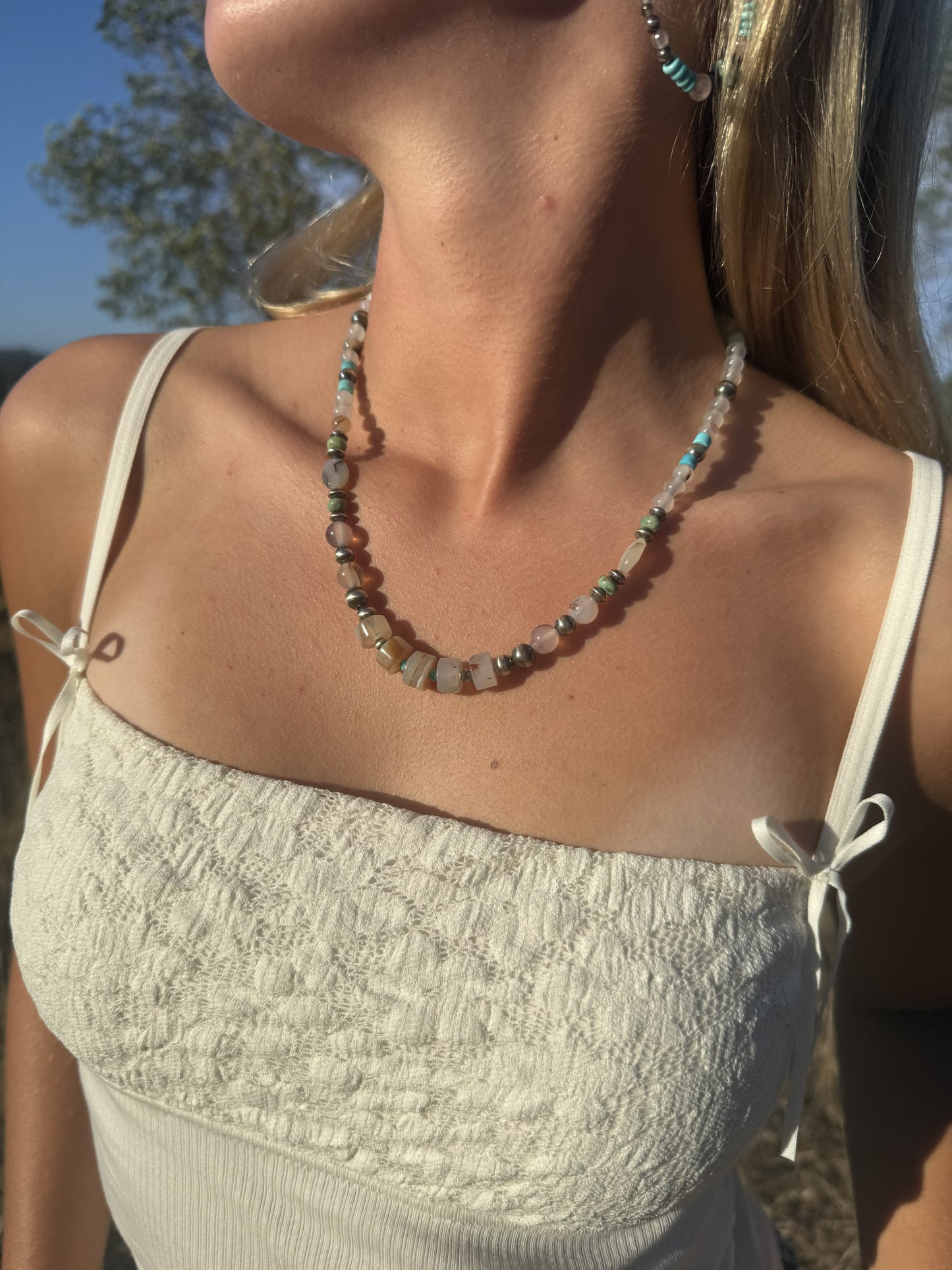 Handmade Montana agate Kingman turquoise and sterling silver pearl beaded necklace worn on model
