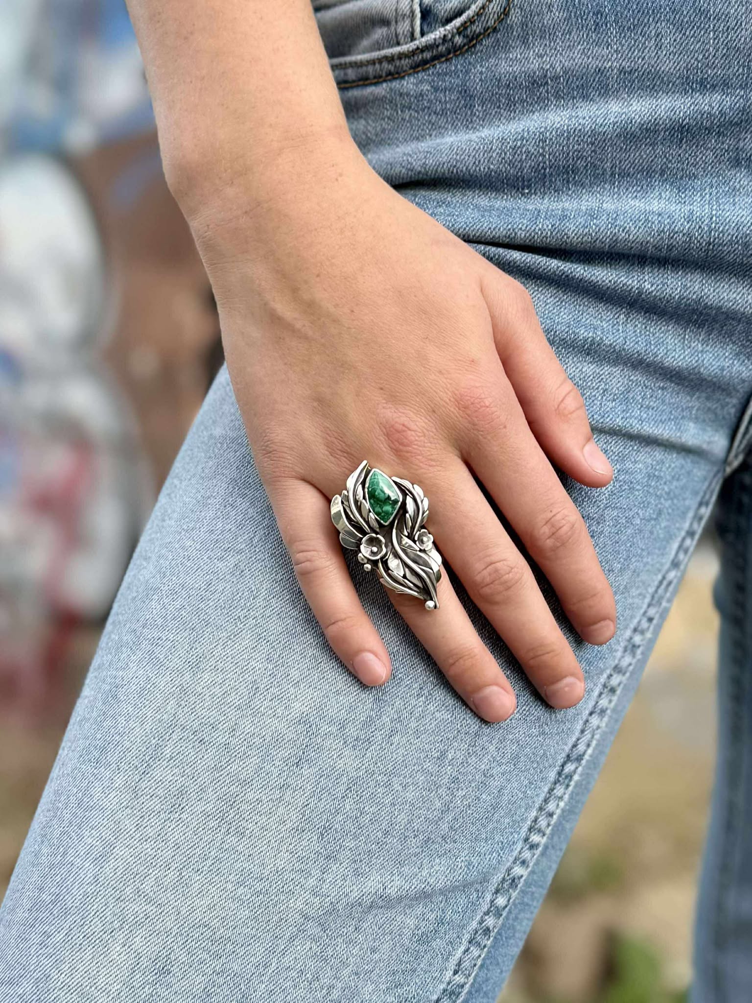 Malachite blossom ring in sterling silver with rich green stone and floral design