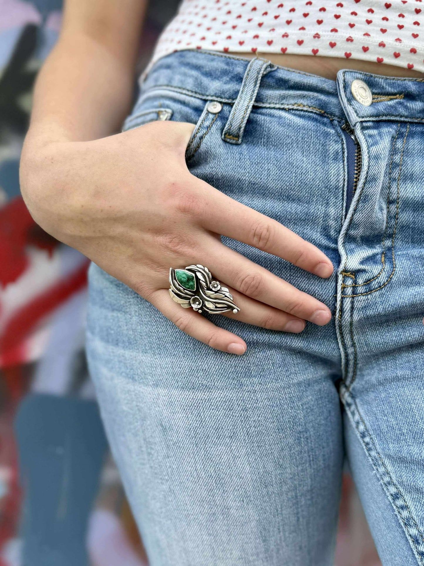 Malachite blossom ring showing size and proportions on finger