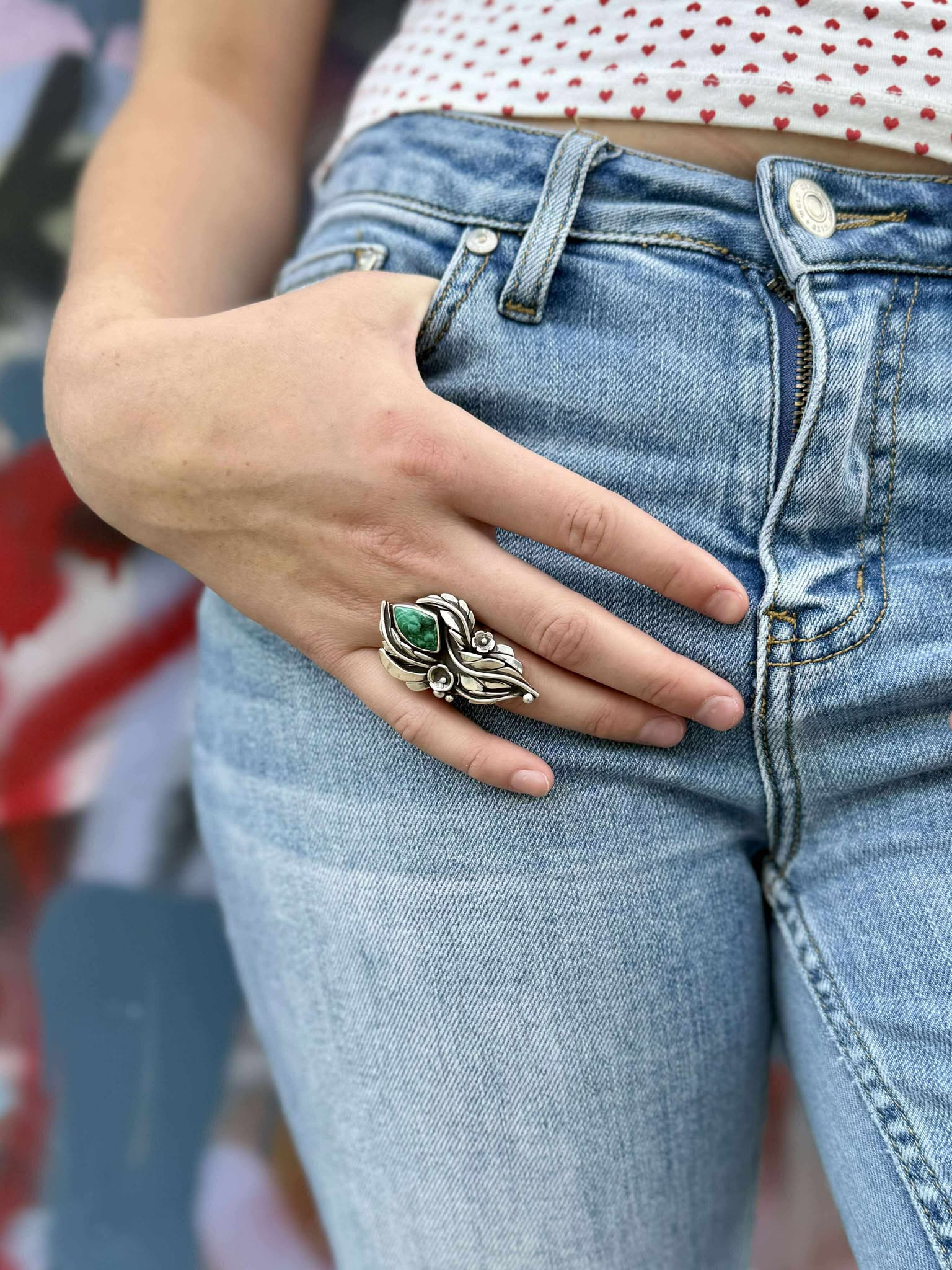 Malachite blossom ring showing size and proportions on finger