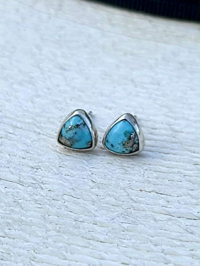 Close-up of Persian turquoise with pyrite showing bright blue color and natural gold inclusions