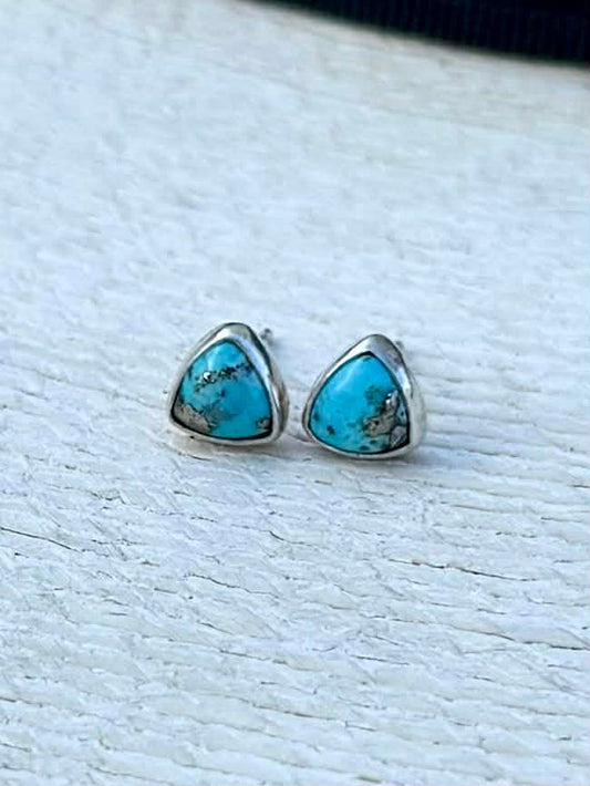 Close-up of Persian turquoise with pyrite showing bright blue color and natural gold inclusions