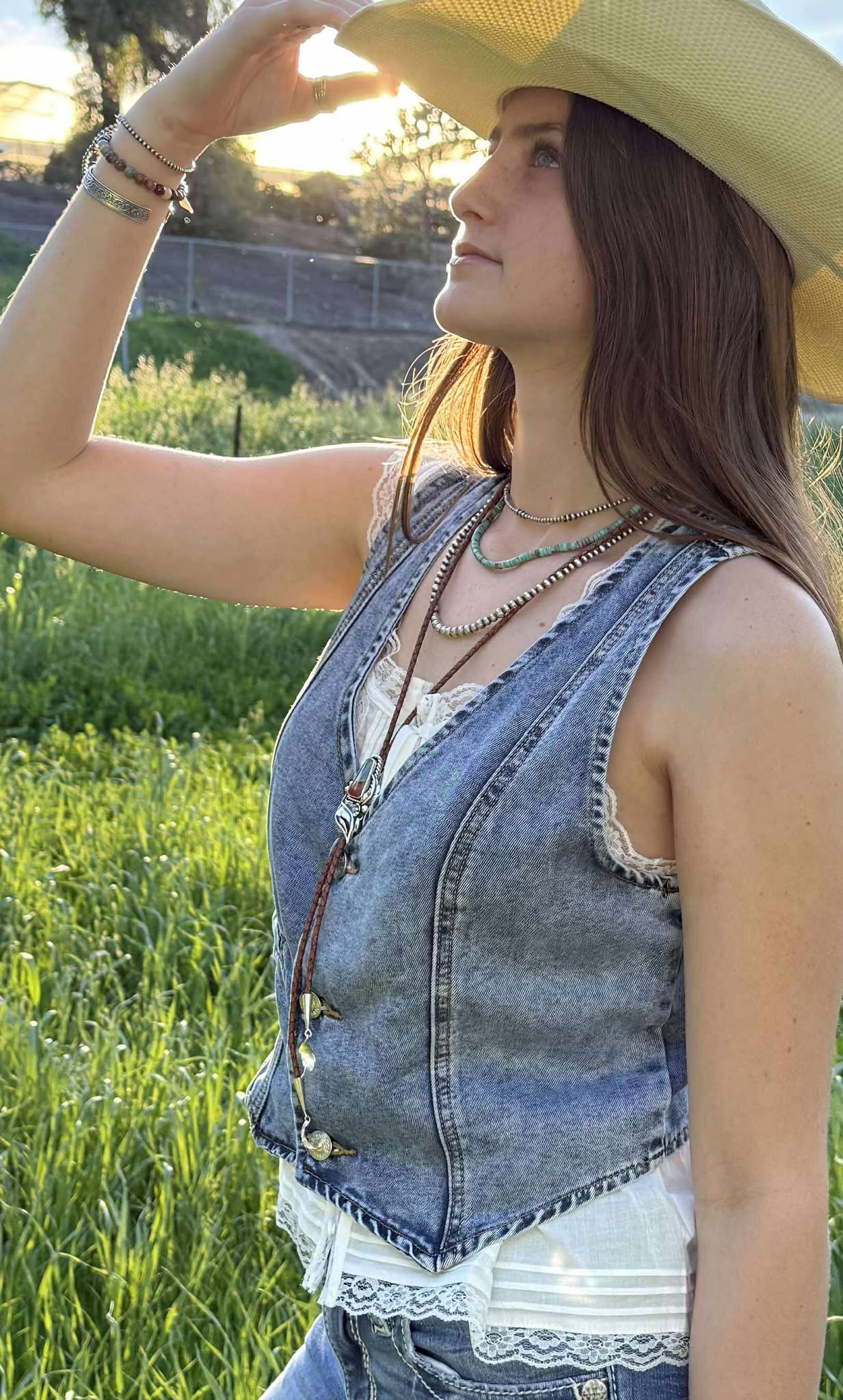 Polychrome jasper bolo tie worn, western cowgirl style accessory