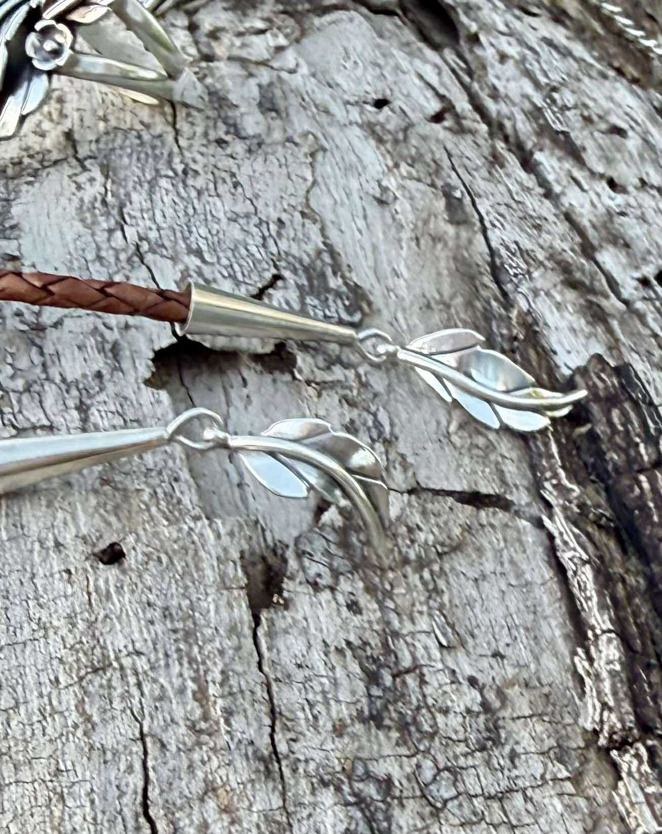 Sterling silver bolo tie tips with braided cord detail