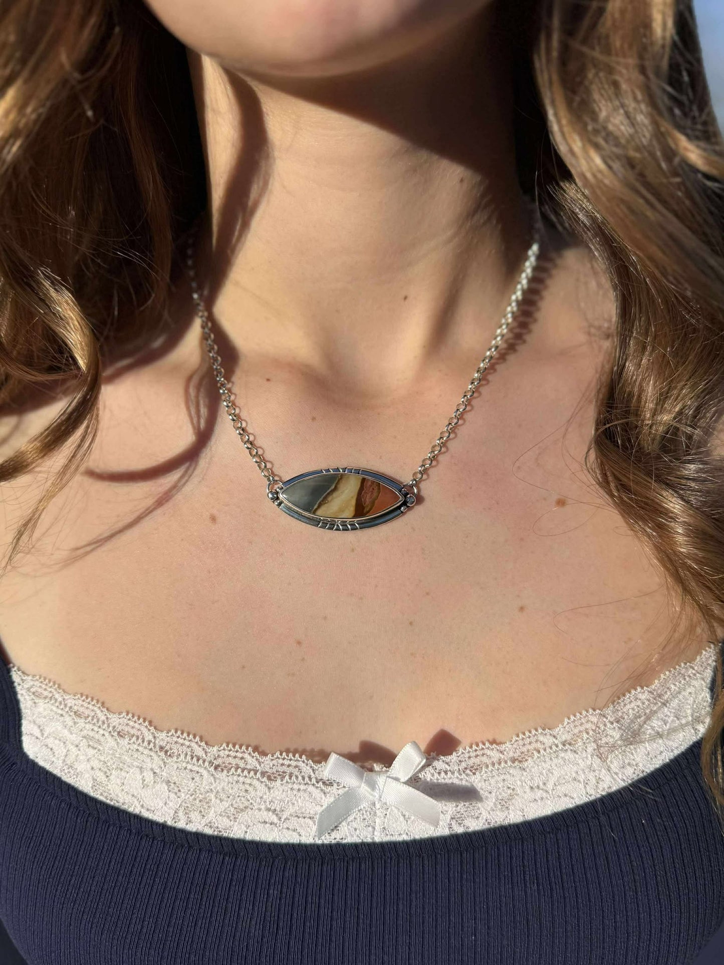 Close-up of polychrome jasper showing natural brown, cream, and red patterns