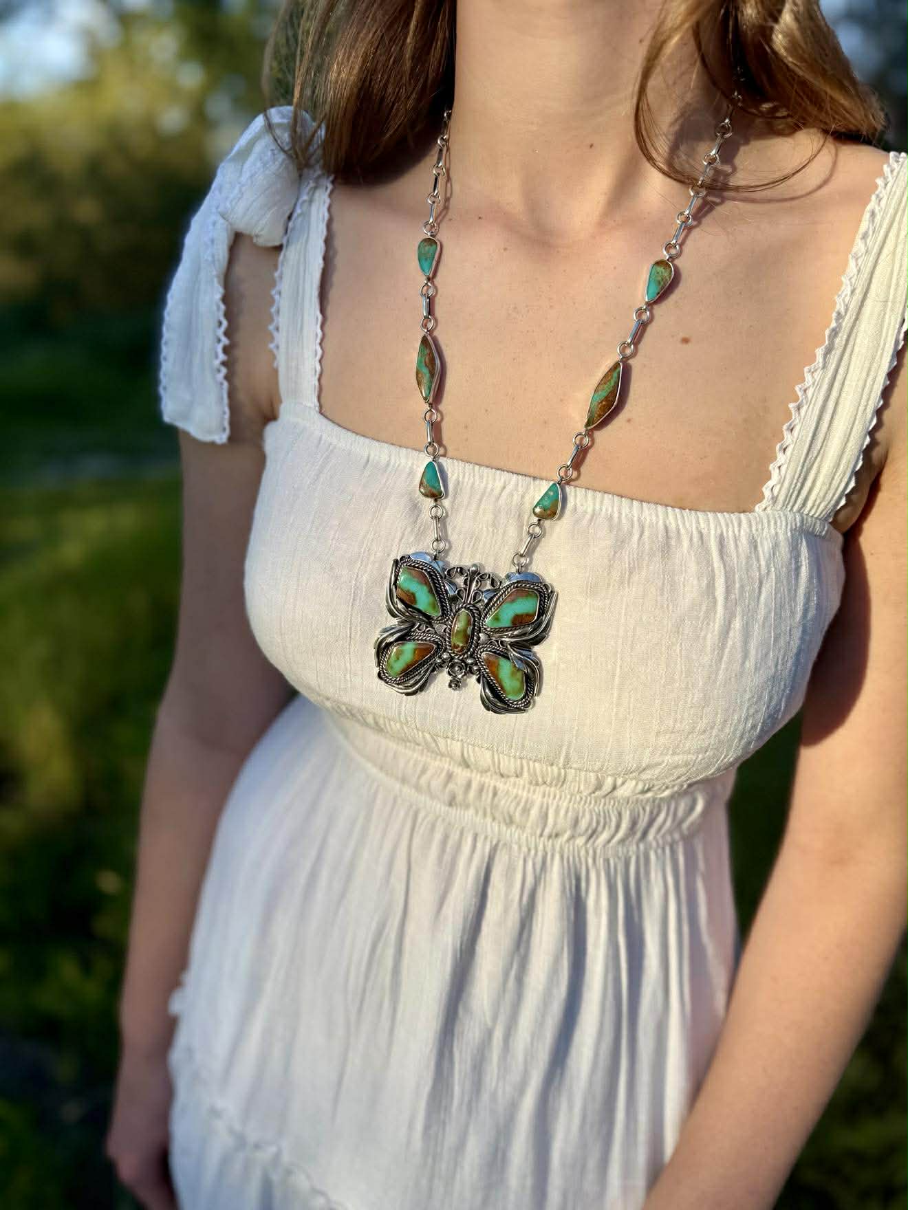 Royston ribbon turquoise butterfly necklace in sterling silver with natural blue and green stone
