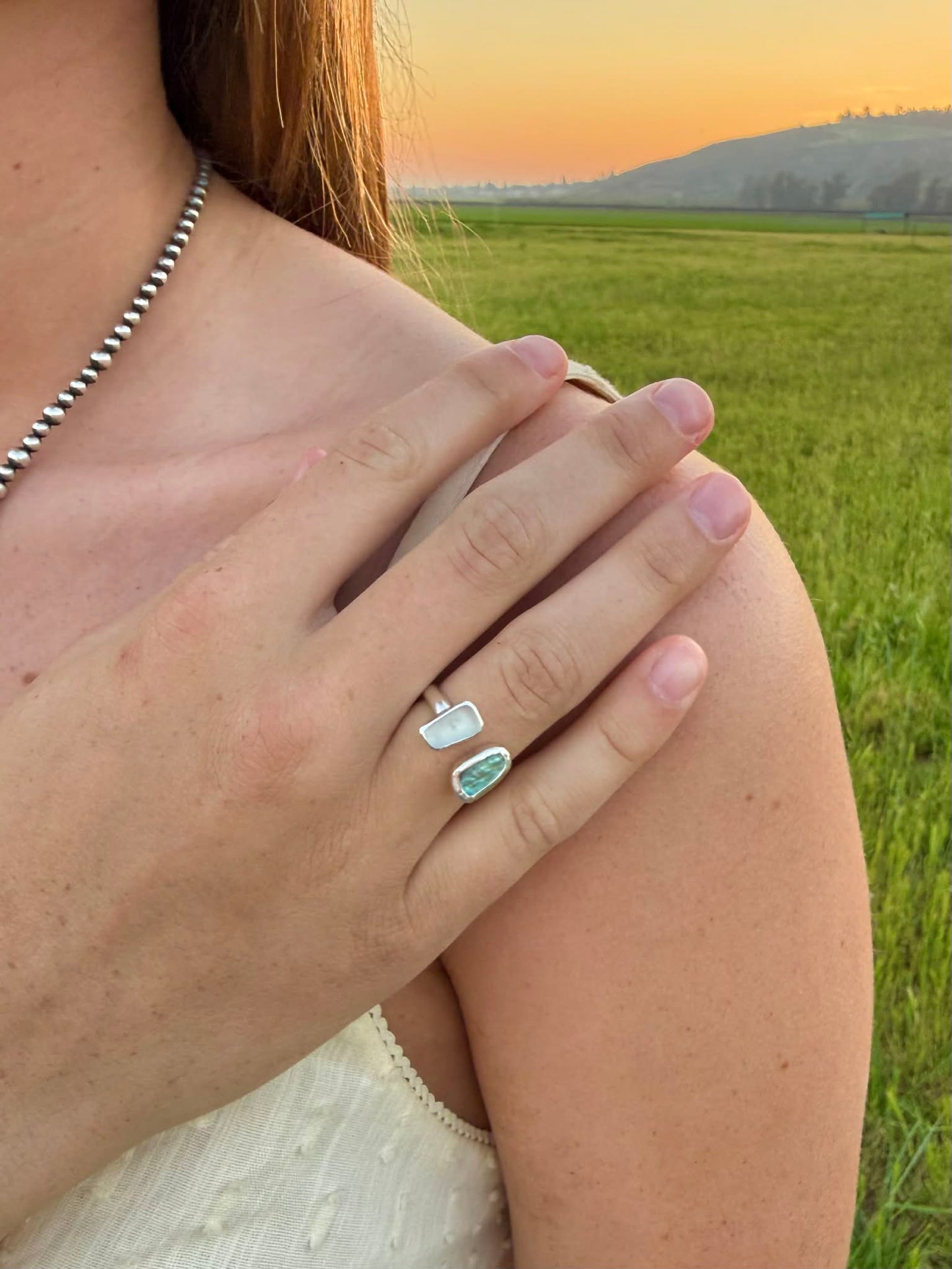 Abalone and sea glass ring worn on hand, coastal boho statement jewelry