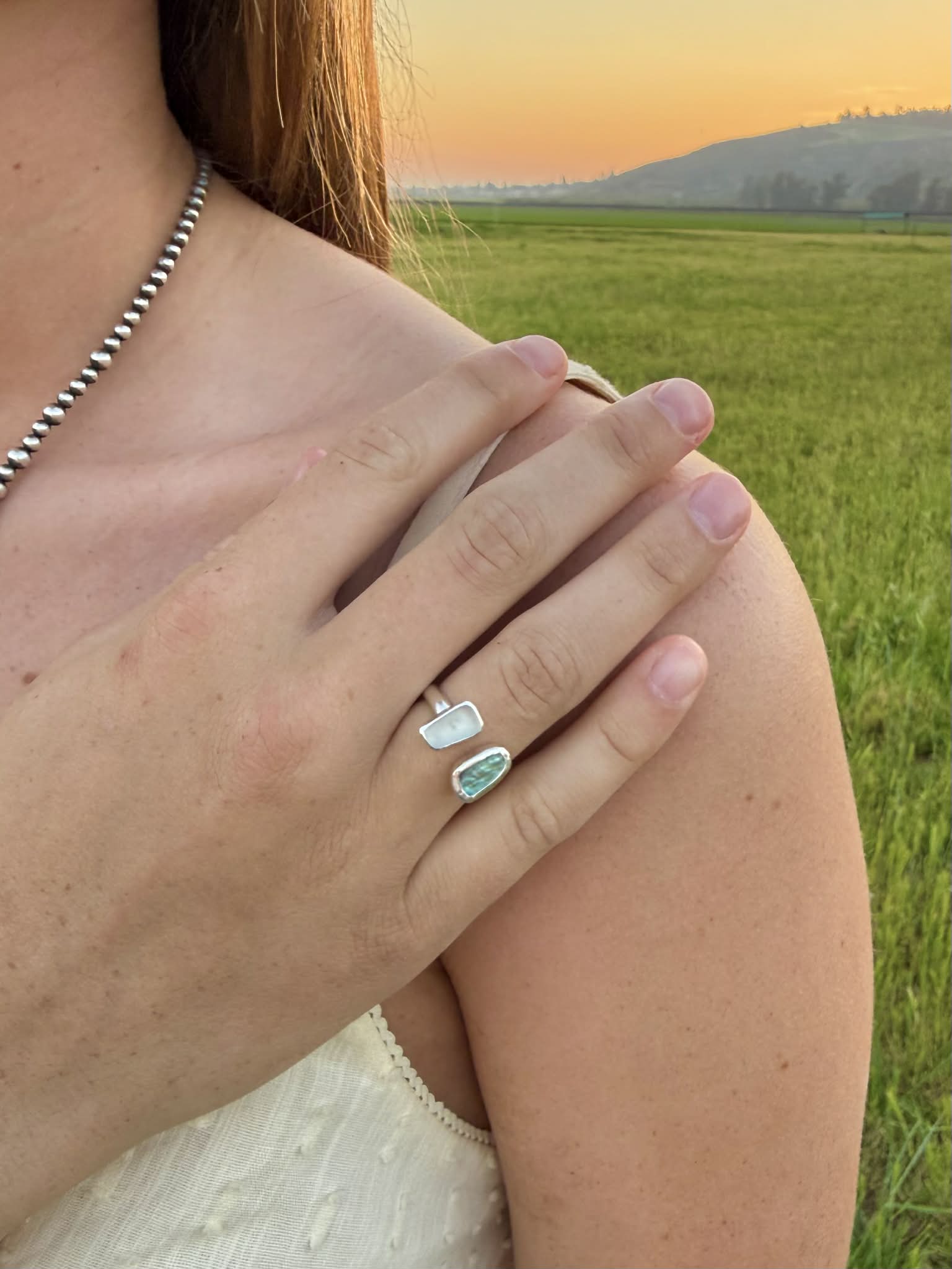 Abalone and sea glass ring worn on hand, coastal boho statement jewelry