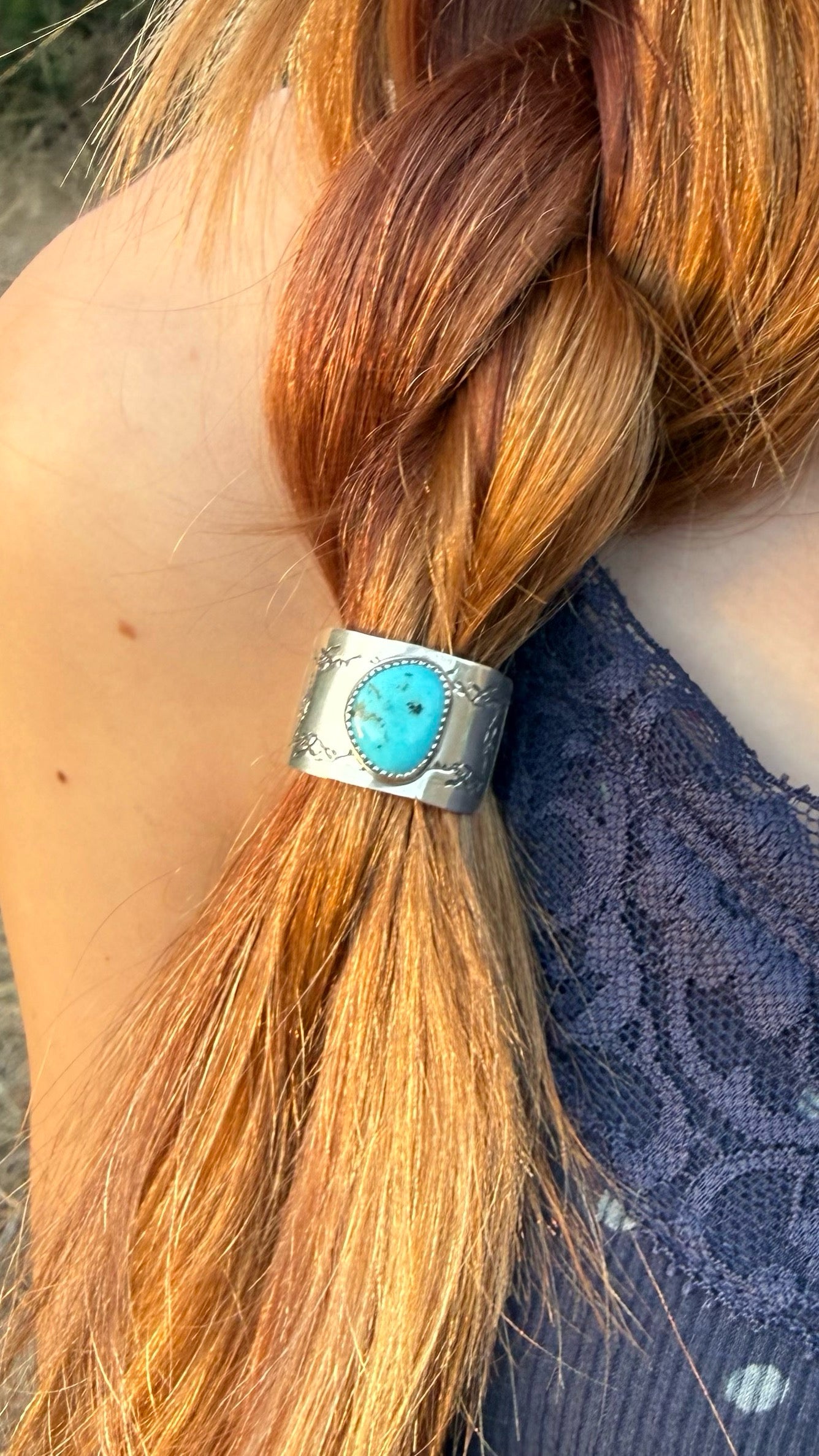 Kingman Turquoise sterling silver braid cover worn in blonde braid, handmade by Donnalee Silver.